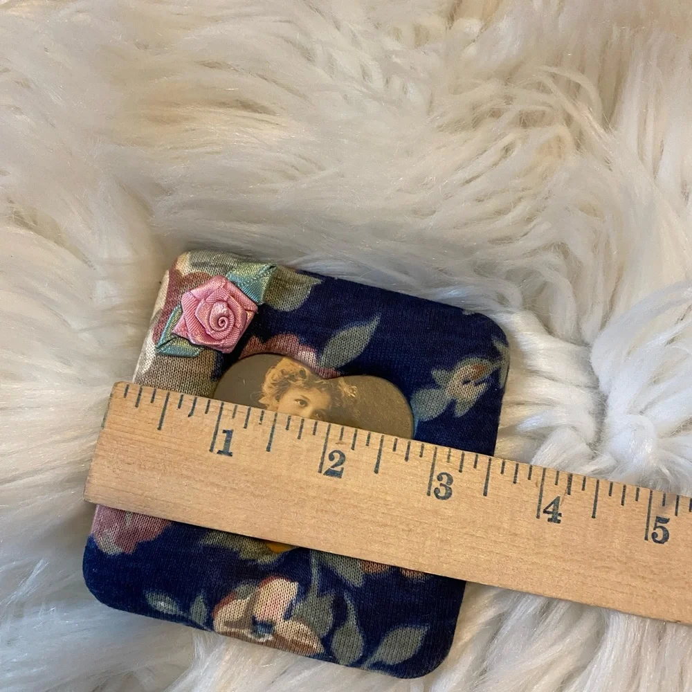 Two small fabric covered picture frames